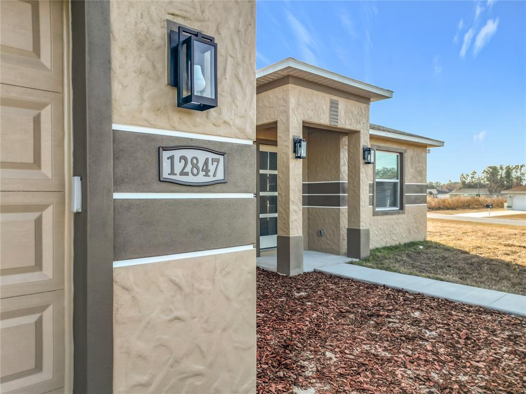 12847 Southwest 73rd Street Ocala, FL 34473 - Photo 5 of 28 a front view of a house