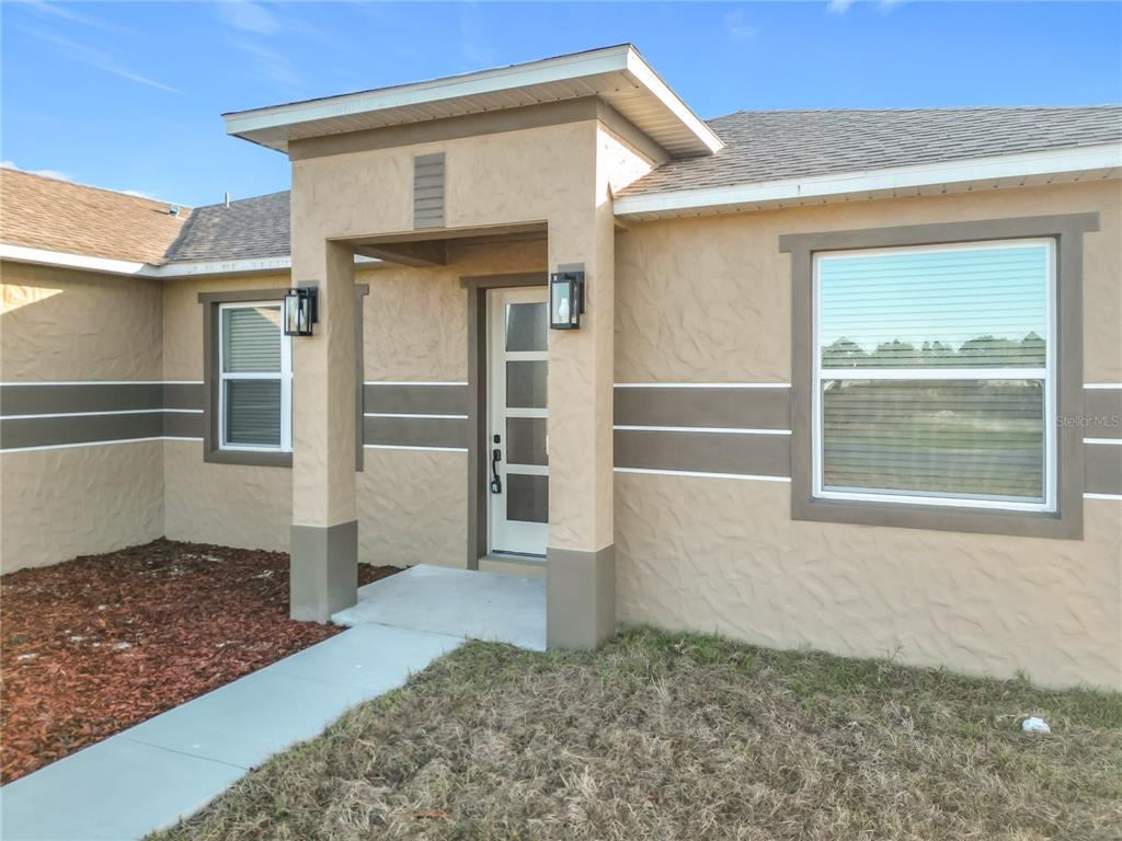 12847 Southwest 73rd Street Ocala, FL 34473 - Photo 6 of 28 a view of front door of house