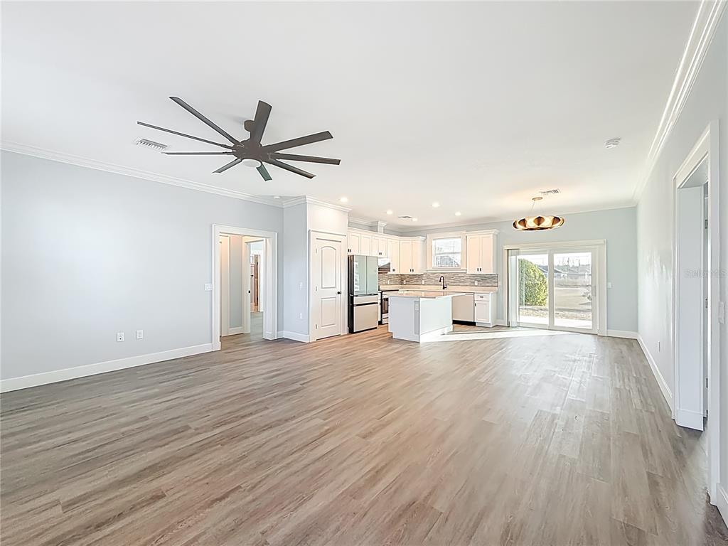 12847 Southwest 73rd Street Ocala, FL 34473 - Photo 7 of 28 a view of an empty room with wooden floor and a window