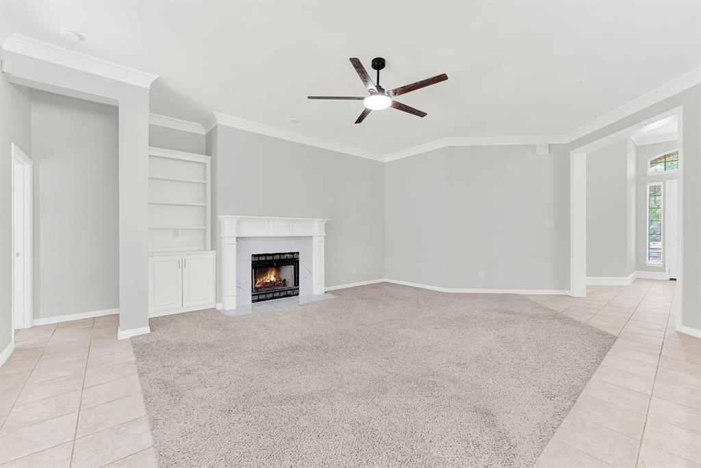 3500 Neiman Road Plano, TX 75025 - Photo 13 of 26 The family room also leads to the primary suite, separate from the other bedrooms for privacy!