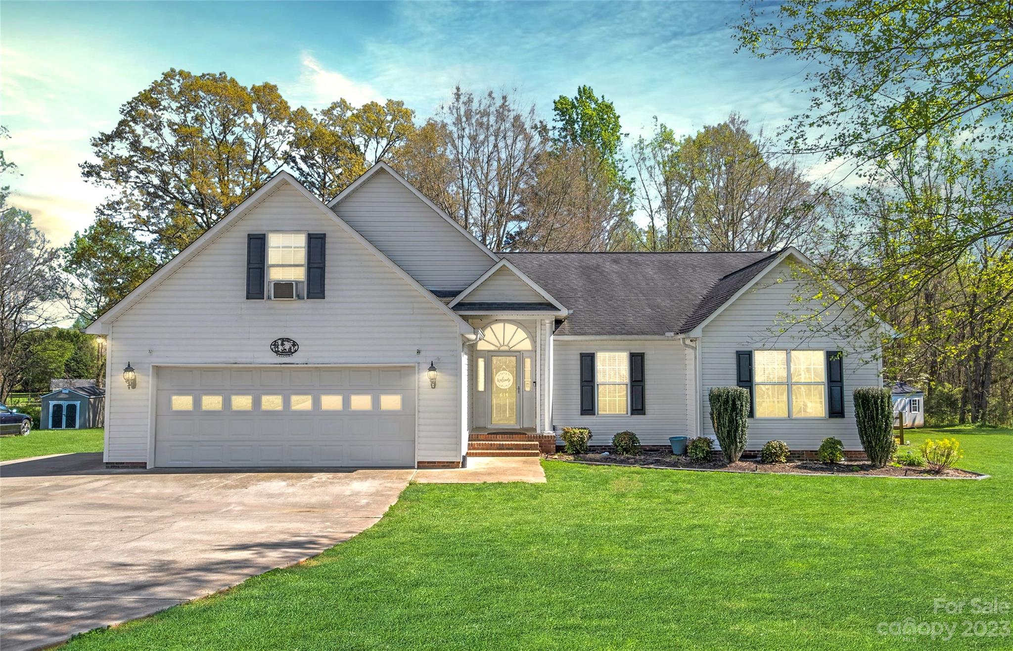 614 Maple Ridge Circle Salisbury, NC 28147 - Photo 1 of 46 a front view of a house with a yard and garage