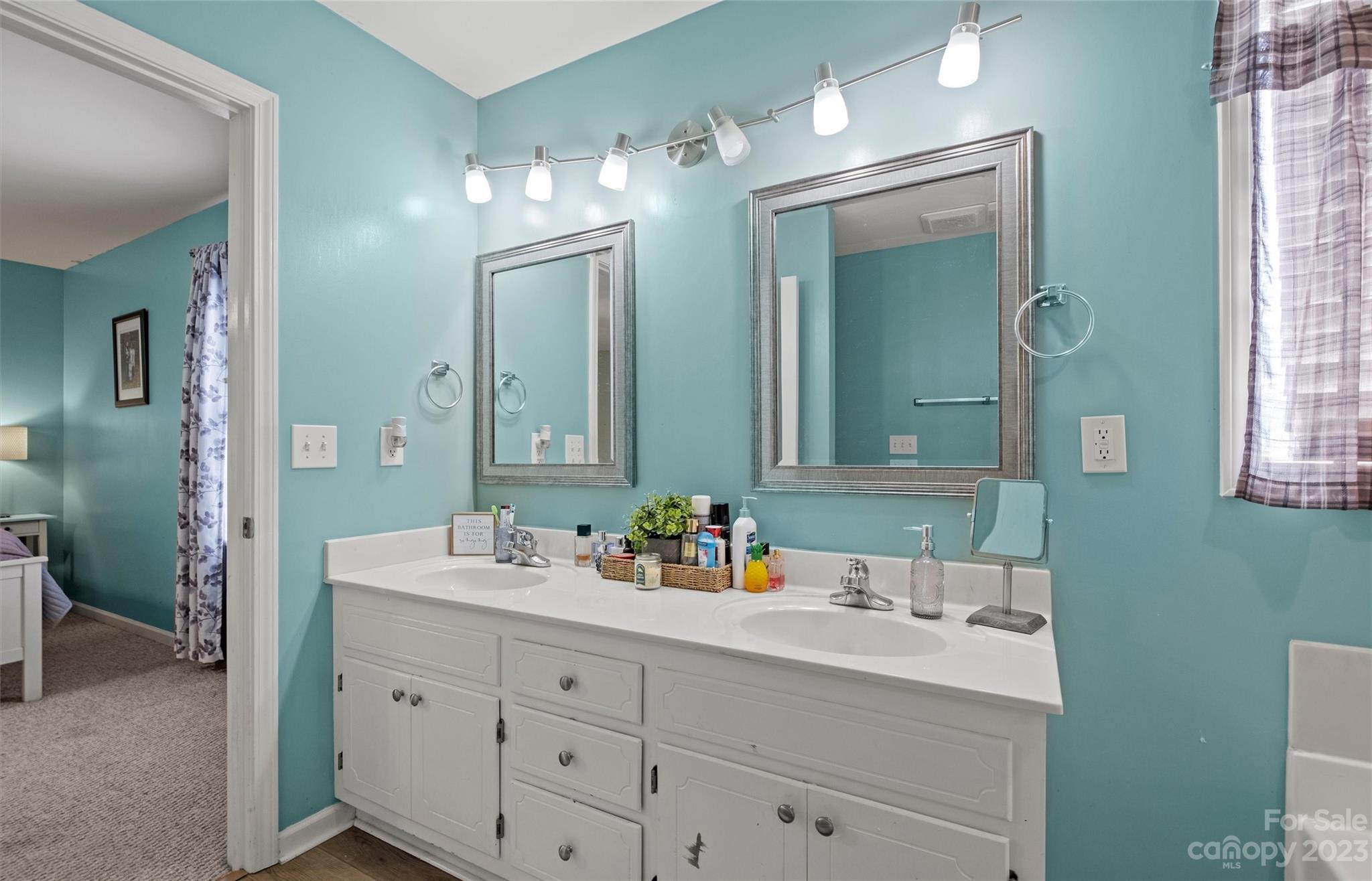 614 Maple Ridge Circle Salisbury, NC 28147 - Photo 25 of 46 a bathroom with a double vanity sink mirror and double