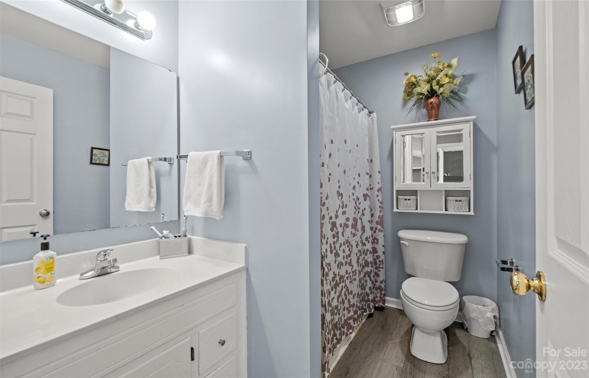 614 Maple Ridge Circle Salisbury, NC 28147 - Photo 26 of 46 a bathroom with a toilet sink and mirror