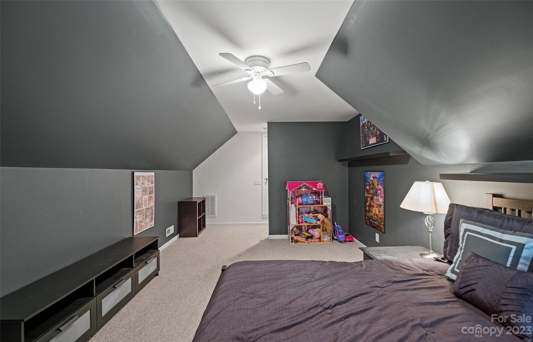 614 Maple Ridge Circle Salisbury, NC 28147 - Photo 33 of 46 a bed room with a bed and a chandelier