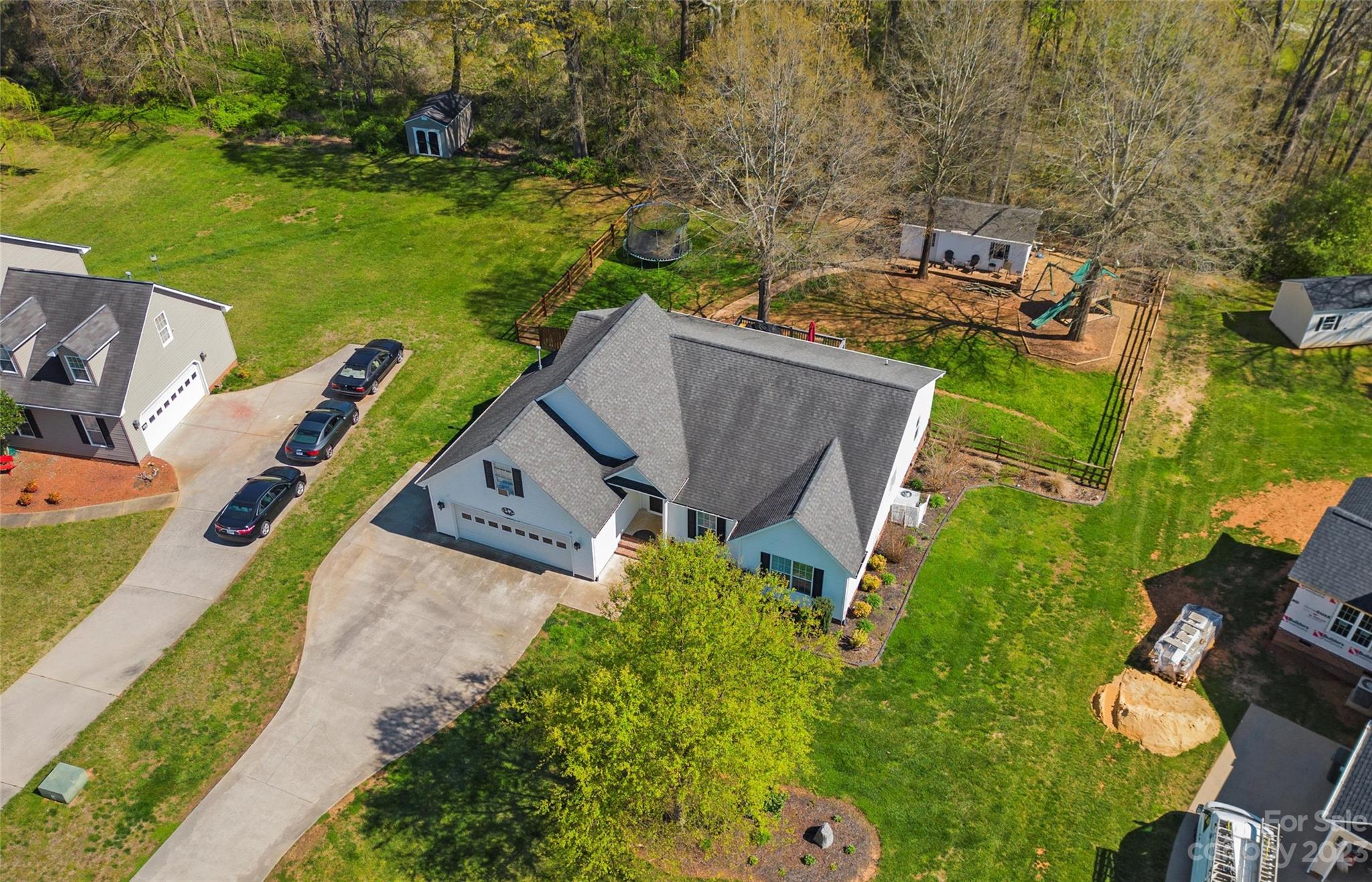 614 Maple Ridge Circle Salisbury, NC 28147 - Photo 5 of 46 an aerial view of a house with a garden and swimming pool
