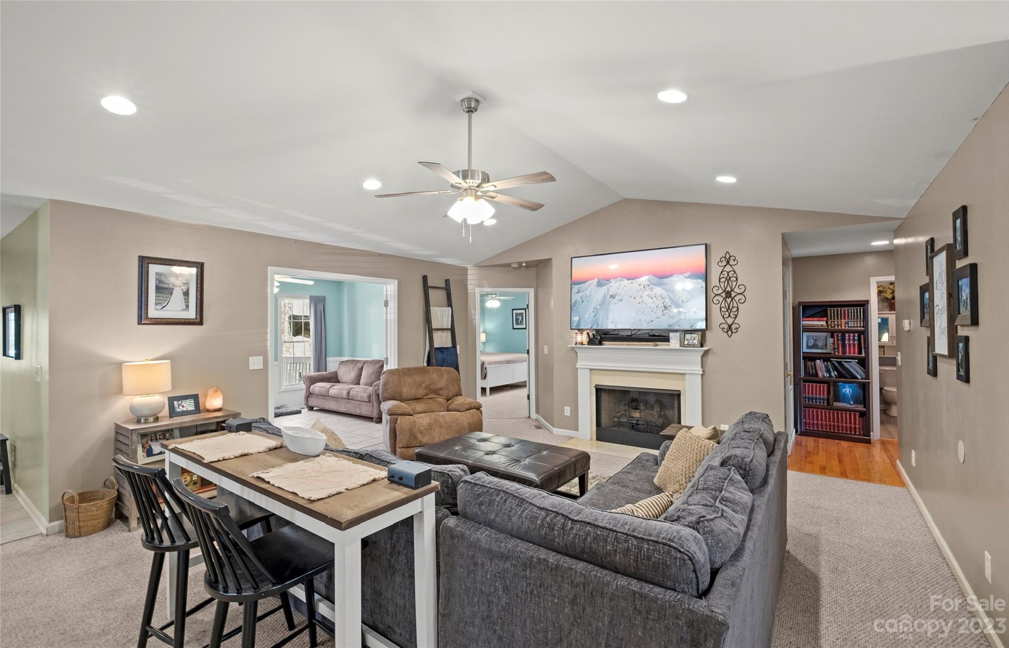 614 Maple Ridge Circle Salisbury, NC 28147 - Photo 10 of 46 a living room with furniture a flat screen tv and a fireplace