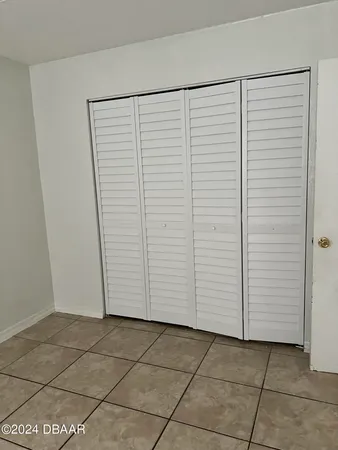 a view of a hallway to rooms