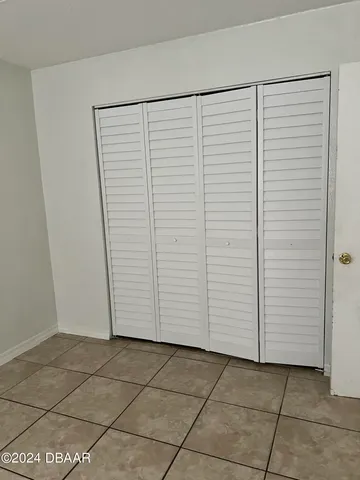 a view of a hallway to rooms