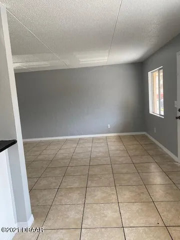 a view of a house with backyard and swimming pool