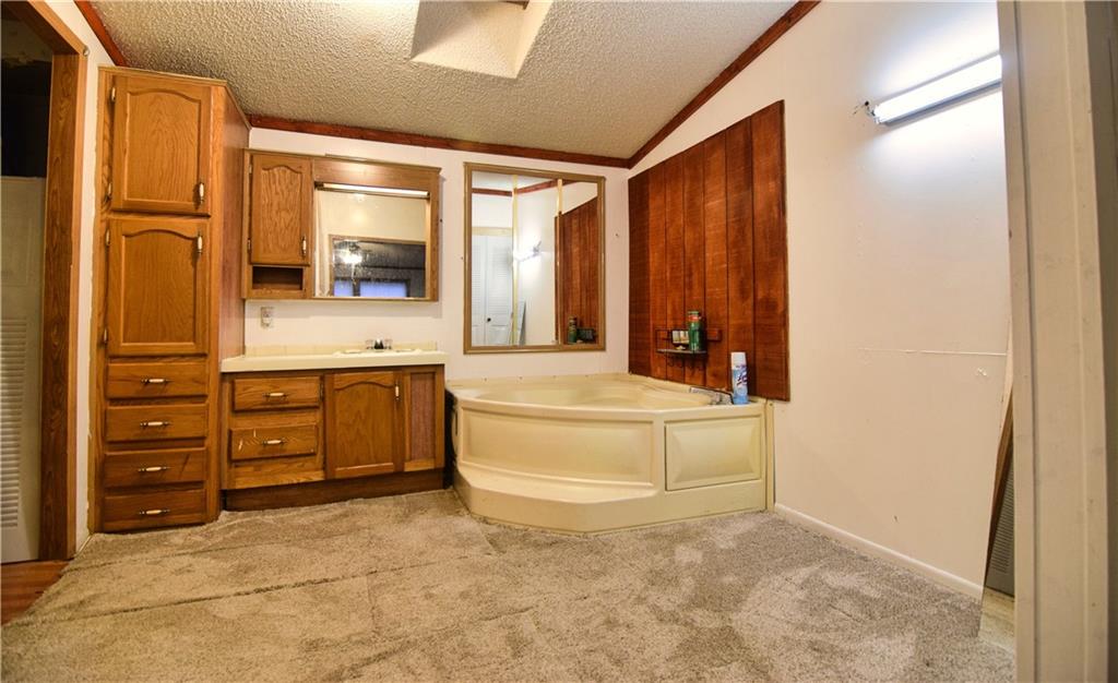 3172 Old Rte 8 Polk, PA 16342 - Photo 14 of 18 a bathroom with a tub sink and mirror
