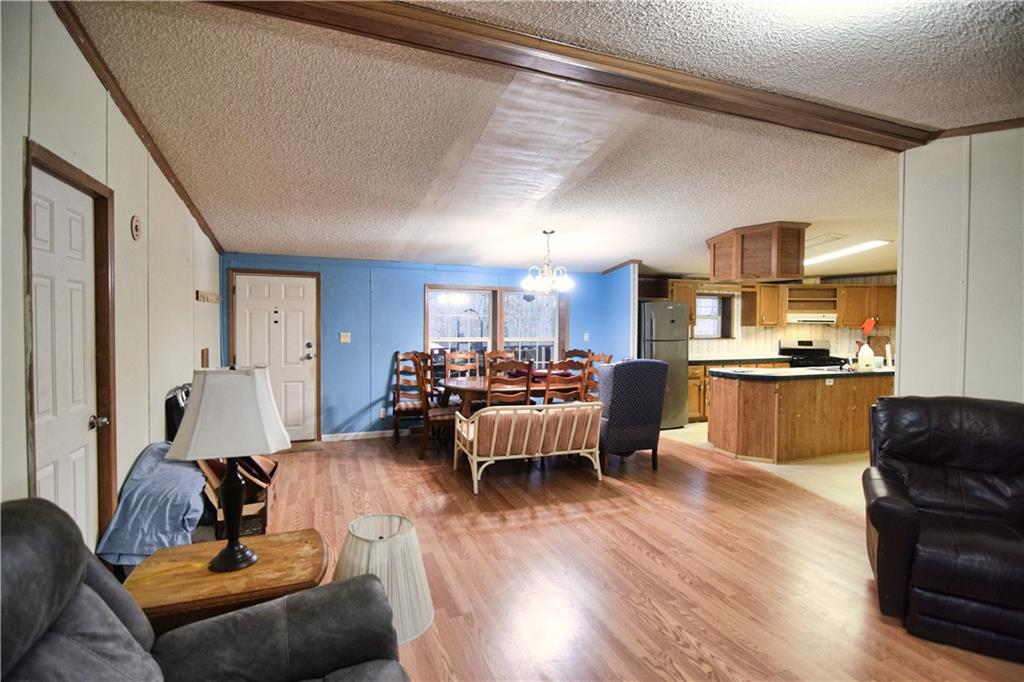 3172 Old Rte 8 Polk, PA 16342 - Photo 6 of 18 a living room with furniture and a view of kitchen