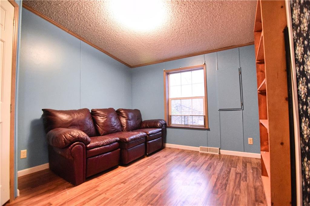 3172 Old Rte 8 Polk, PA 16342 - Photo 10 of 18 a living room with furniture and a wooden floor