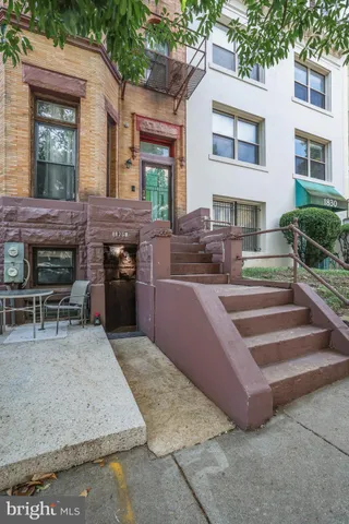 a view of outdoor kitchen and dining room