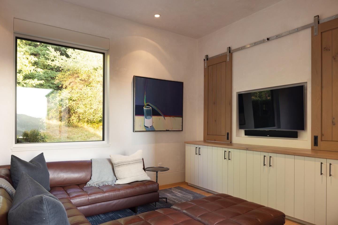 19 Rancho San Carlos Road Carmel, CA 93923 - Photo 24 of 30 a living room with furniture and a flat screen tv