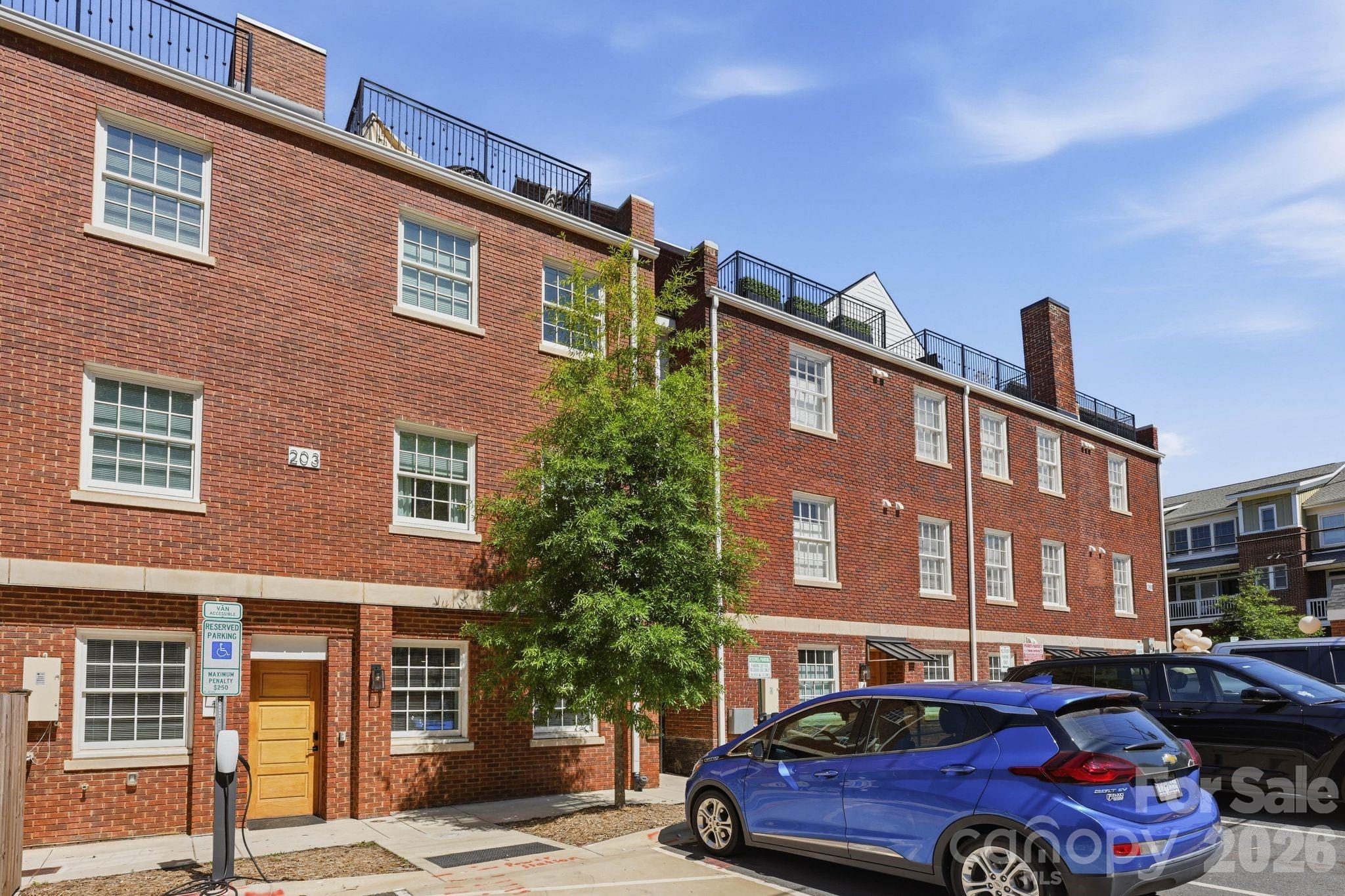 203 Grandin Road, Unit 1 Charlotte, NC 28208 - Photo 14 of 32 a front view of a building with parking space