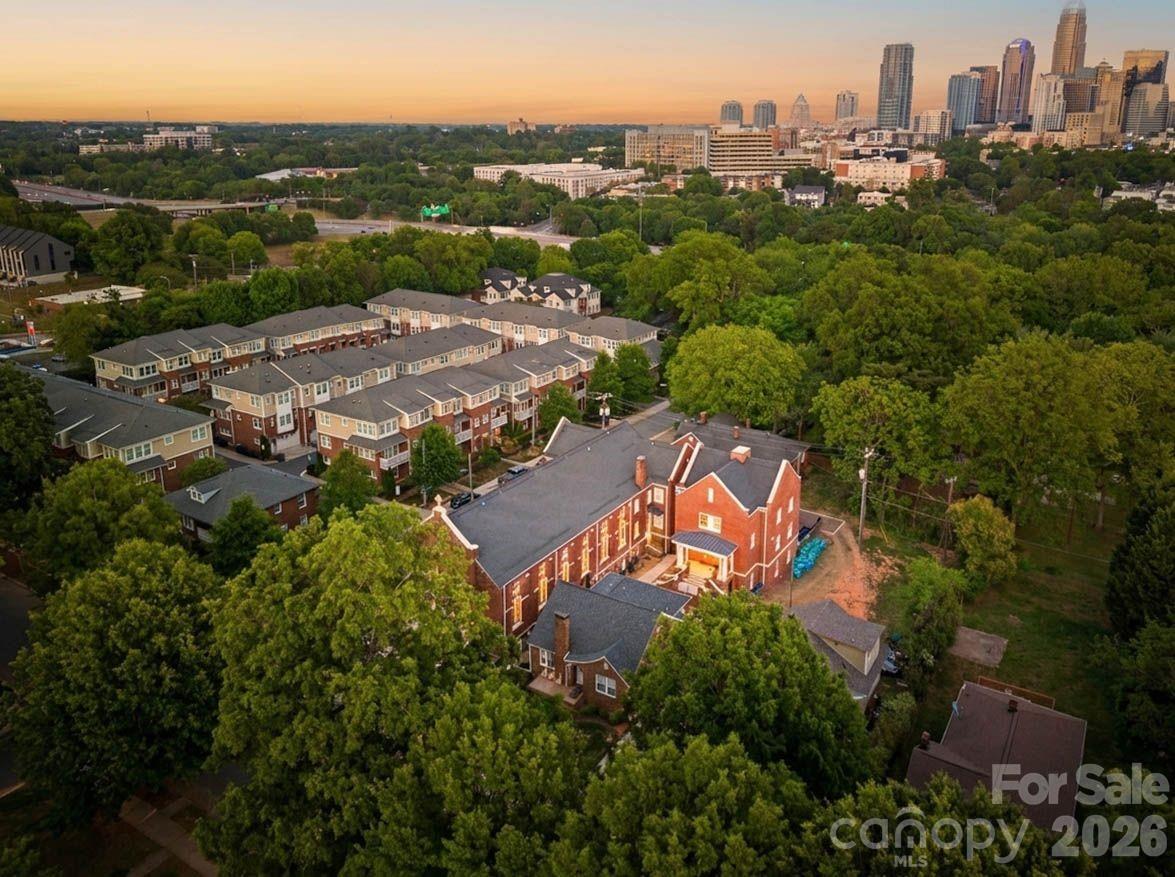 203 Grandin Road, Unit 1 Charlotte, NC 28208 - Photo 7 of 32 an aerial view of residential houses with outdoor space and trees