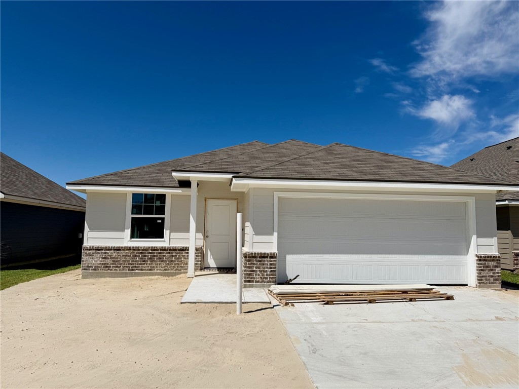 a front view of a house with a garage