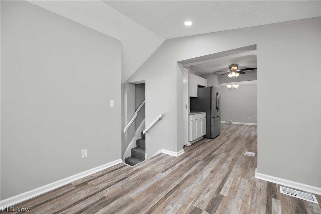 7030 Pearl Road Cleveland, OH 44130 - Photo 10 of 34 Unfurnished Bonus room featuring light hardwood / wood-style floors, ceiling fan, and vaulted ceiling