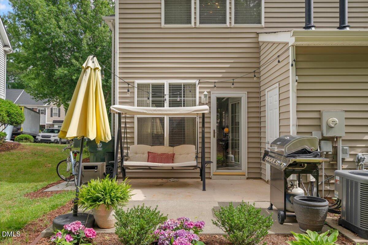 8449 Central Drive Raleigh, NC 27613 - Photo 33 of 38 a view of a house with backyard and sitting area