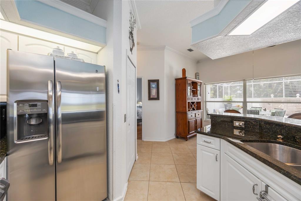 48 Bunker Road Rotonda West, FL 33947 - Photo 22 of 59 a kitchen with stainless steel appliances granite countertop a refrigerator and a sink
