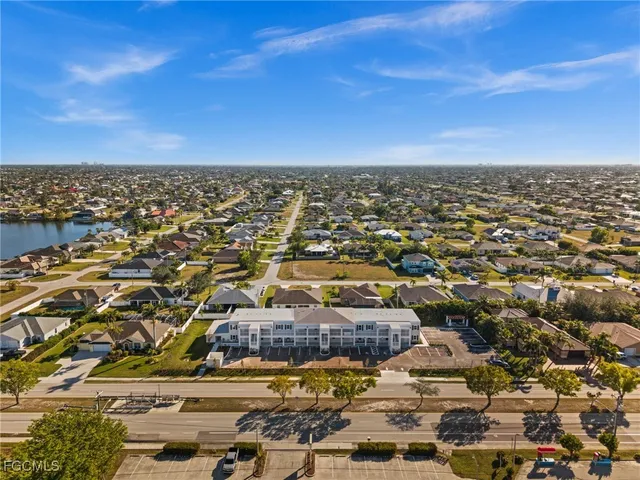 an aerial view of residential houses with city view