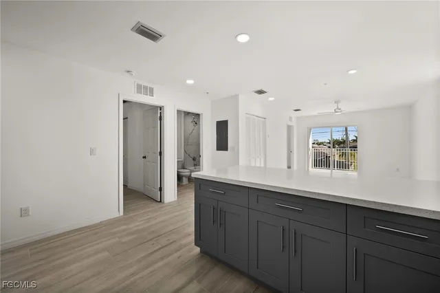 a view of a kitchen counter space and wooden floor