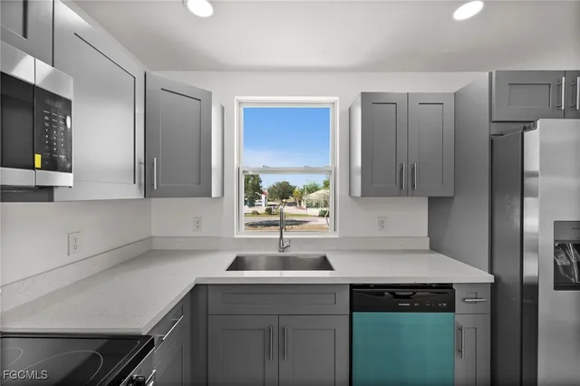a kitchen with a sink and cabinets