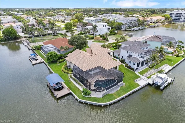 an aerial view of a house with a lake view