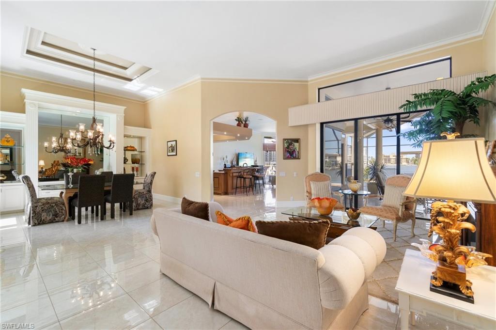 431 Palm Court Naples, FL 34108 - Photo 18 of 50 a living room with furniture and a large window