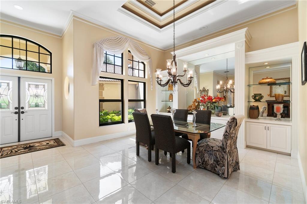 431 Palm Court Naples, FL 34108 - Photo 19 of 50 a view of a dining room with furniture and window
