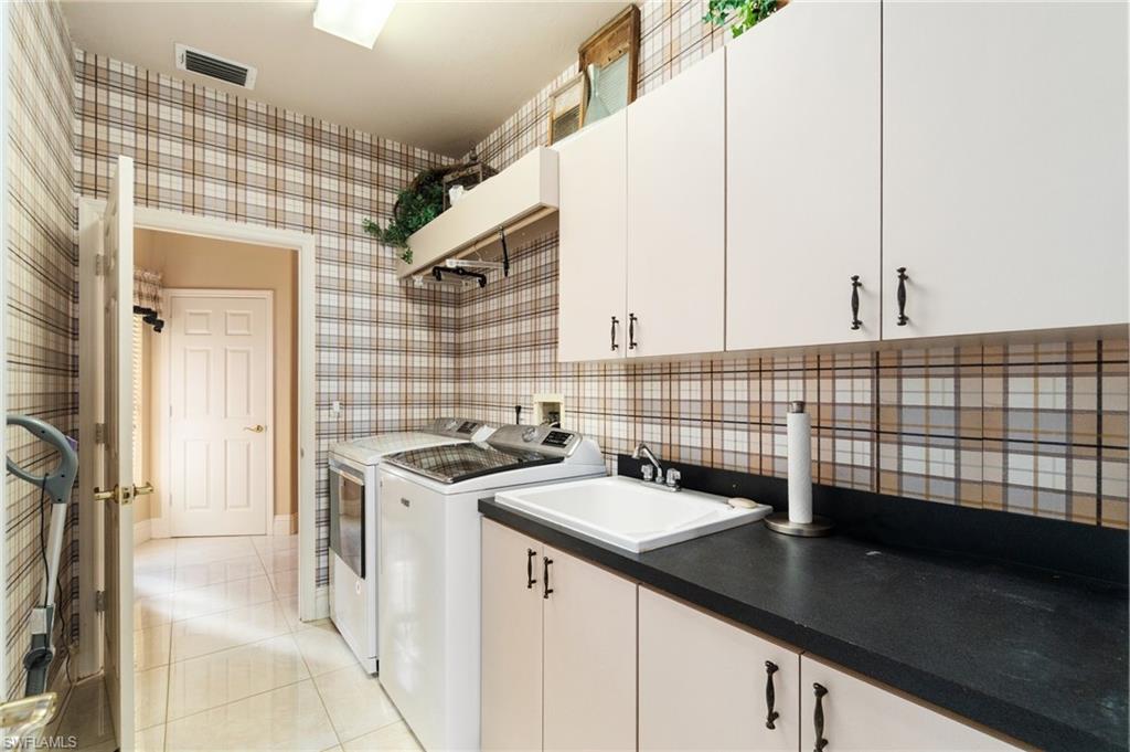 431 Palm Court Naples, FL 34108 - Photo 29 of 50 a view of a kitchen with a sink and cabinets