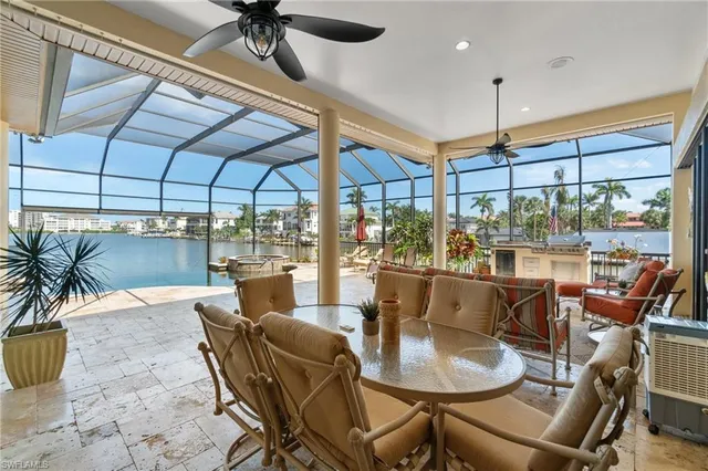 a view of a dining room with furniture wooden floor and chandelier