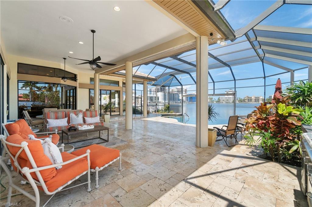 431 Palm Court Naples, FL 34108 - Photo 40 of 50 a outdoor living space with patio furniture and a potted plant