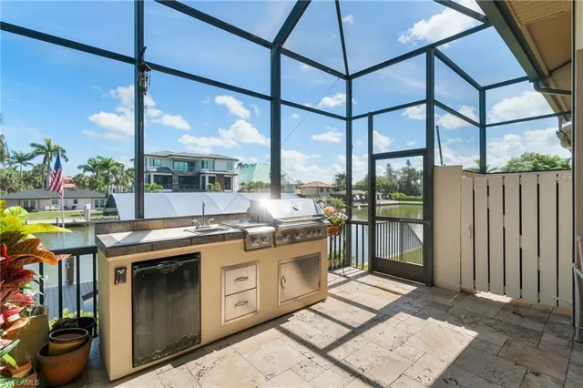 a patio with a table and chairs