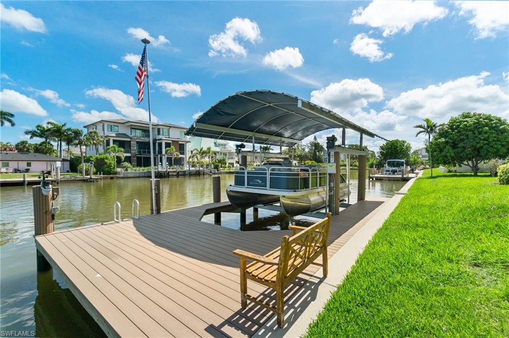 431 Palm Court Naples, FL 34108 - Photo 47 of 50 a view of a house with backyard porch and sitting area