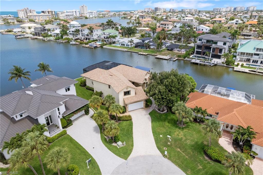 431 Palm Court Naples, FL 34108 - Photo 5 of 50 an aerial view of a house with a lake view