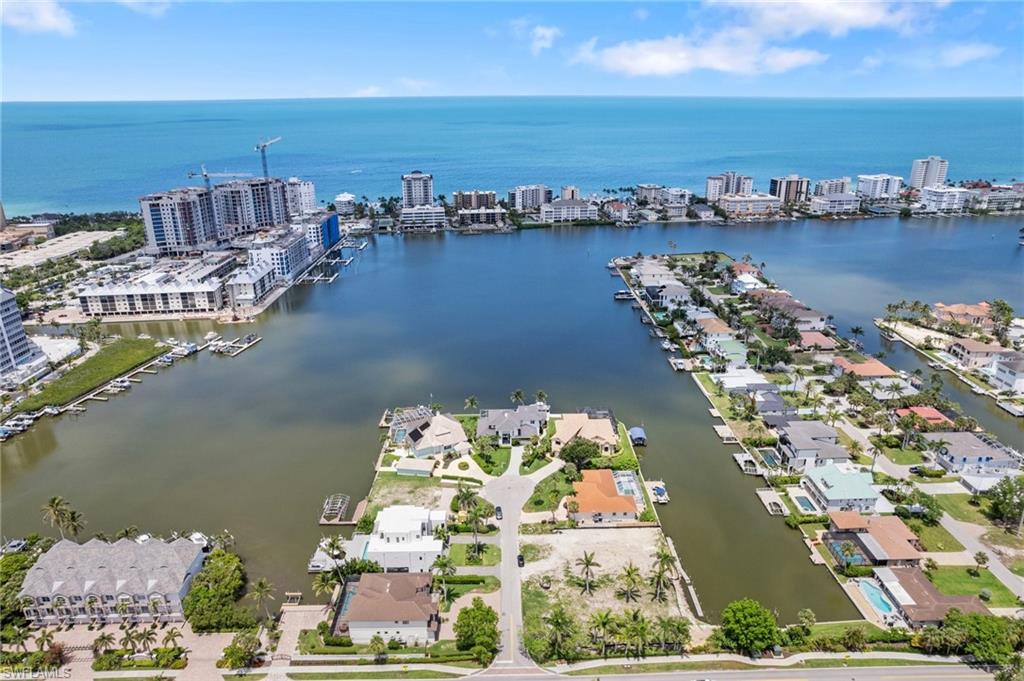 431 Palm Court Naples, FL 34108 - Photo 8 of 50 an aerial view of a city with lawn chairs