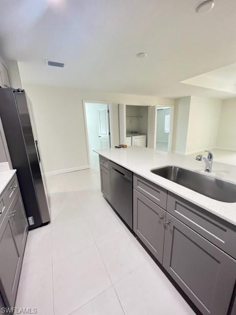 4414 Douglas Lane Lehigh Acres, FL 33973 - Photo 12 of 15 Kitchen with white fridge, gray cabinets, and light stone countertops
