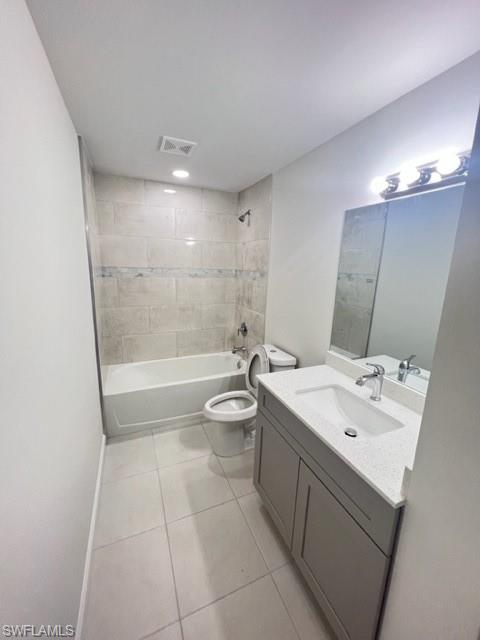 4414 Douglas Lane Lehigh Acres, FL 33973 - Photo 7 of 15 Bathroom featuring washtub / shower combination, vanity, and light tile patterned floors