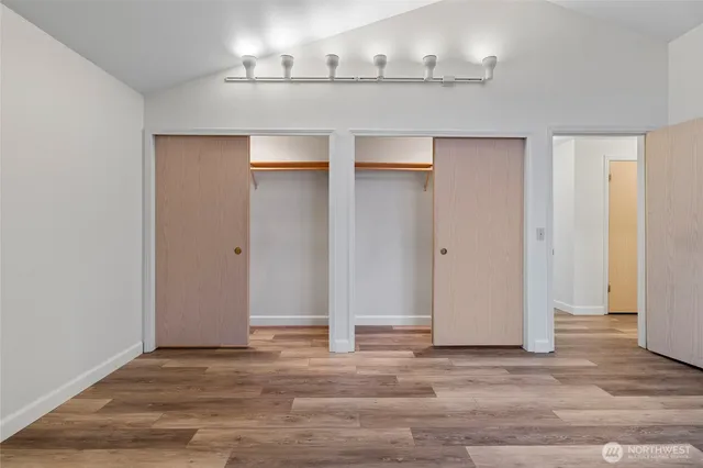 an empty room with wooden floor