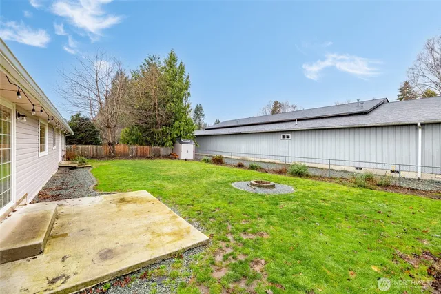 a view of a backyard with a small pool