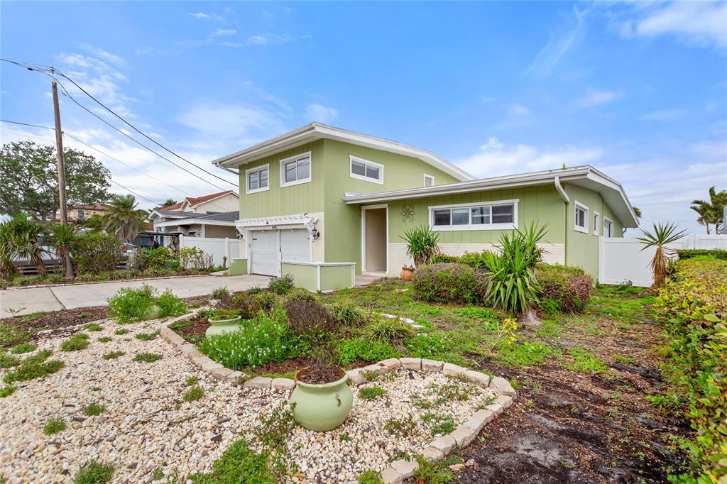 16103 6th Street East Redington Beach, FL 33708 - Photo 1 of 1 a front view of a house with a yard