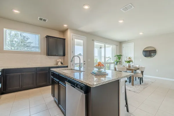 a kitchen with sink cabinets and window