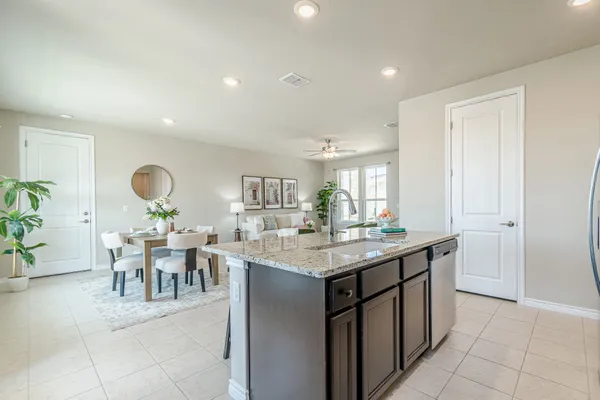 a kitchen with a table and chairs in it