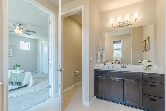 a bathroom with a double vanity sink and a mirror