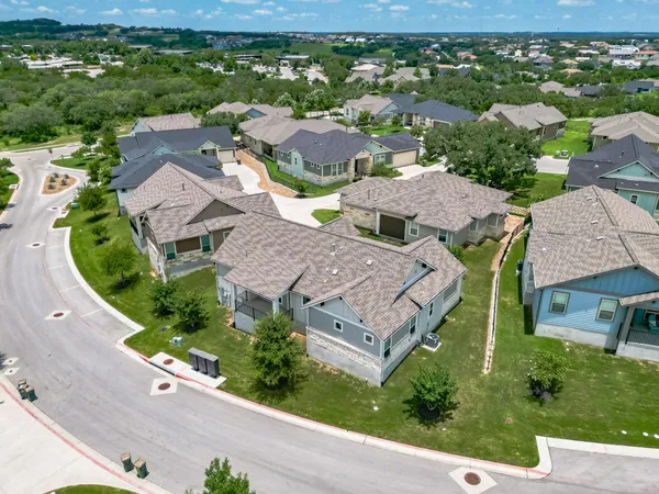 an aerial view of residential house with outdoor space and street view
