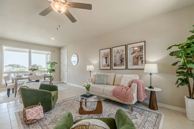 a living room with furniture and a large window