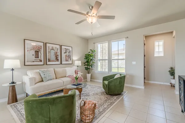 a living room with furniture and a window