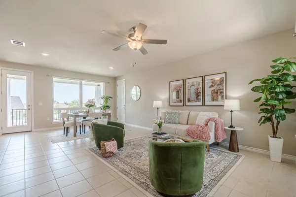 a living room with furniture and a large window