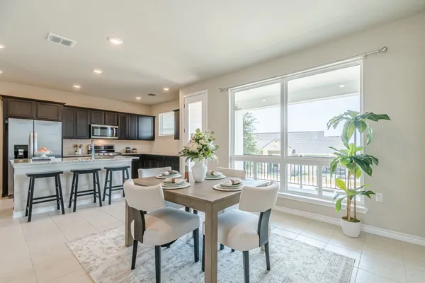 a view of a dining room with furniture window and outdoor view